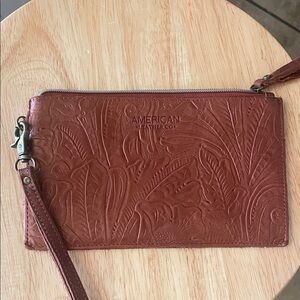 American Leather Co brown stamped leather wristlet